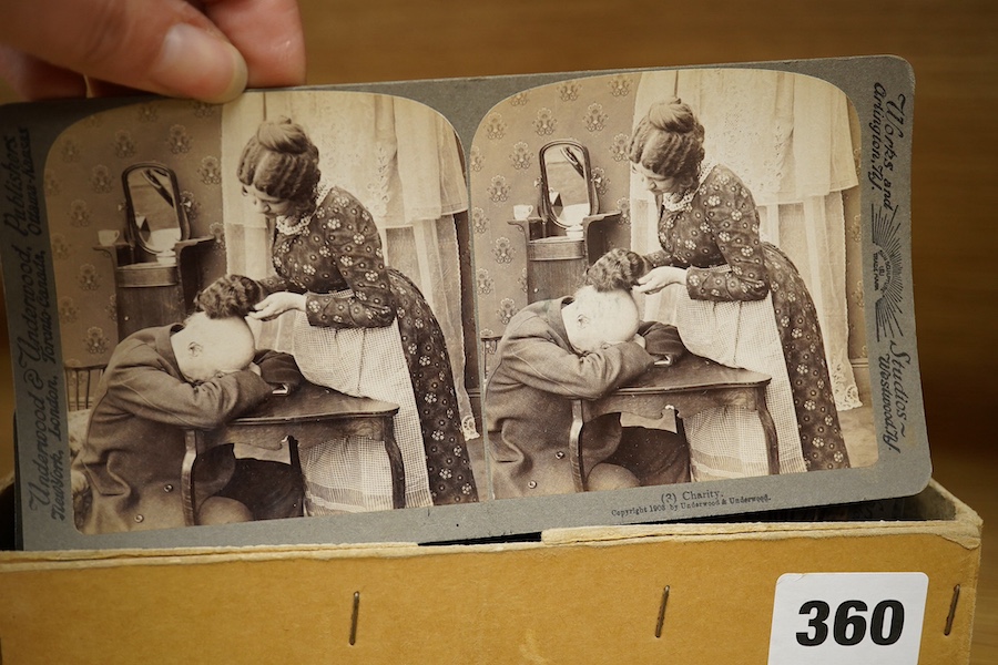 A stereoscope viewer with a collection of comical viewing cards. Condition - cards - fair/good, viewer - poor